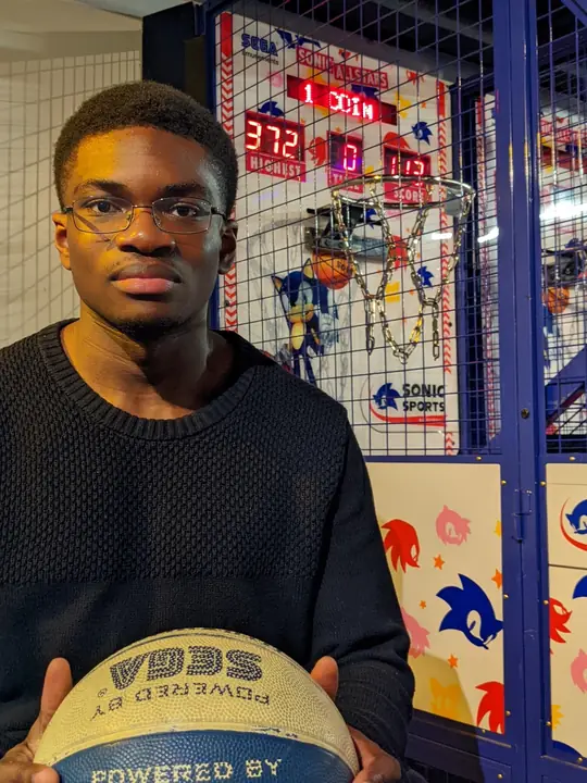 Portrait at an arcade basketball game