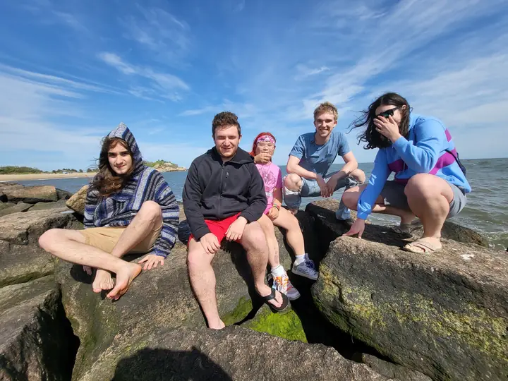 Group portrait on shoreline rocks