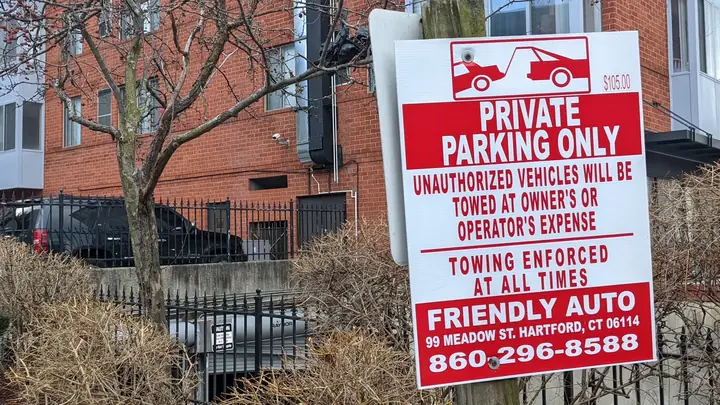 Urban documentary detail with a private parking sign